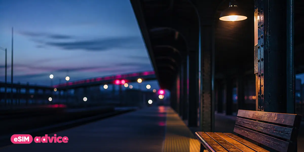 A quiet metro station platform at blue hour