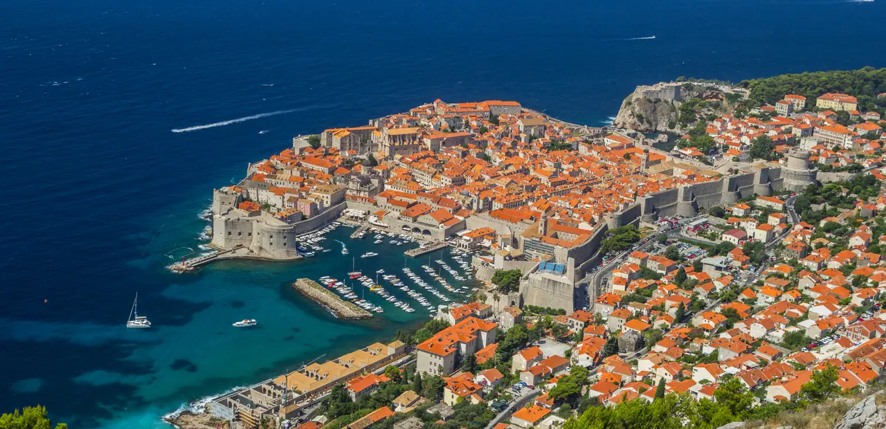 Aerial view of Dubrovnik's old town and harbour, a Mediterranean cruise port where a travel eSIM connects while ashore